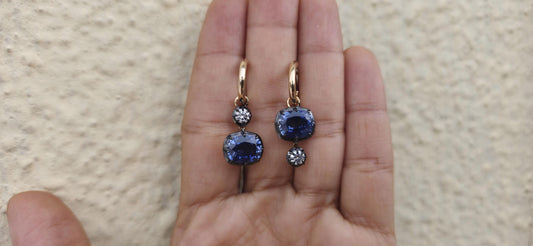 Women 4 stone asymmetric earrings, elongated cushion lab blue sapphire and cushion moissanite set in Georgian cut down button back setting.