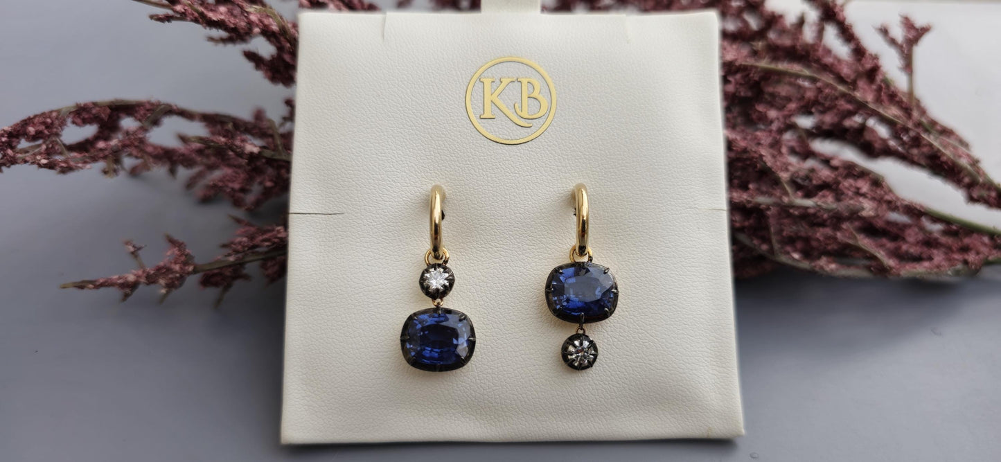 Women 4 stone asymmetric earrings, elongated cushion lab blue sapphire and cushion moissanite set in Georgian cut down button back setting.