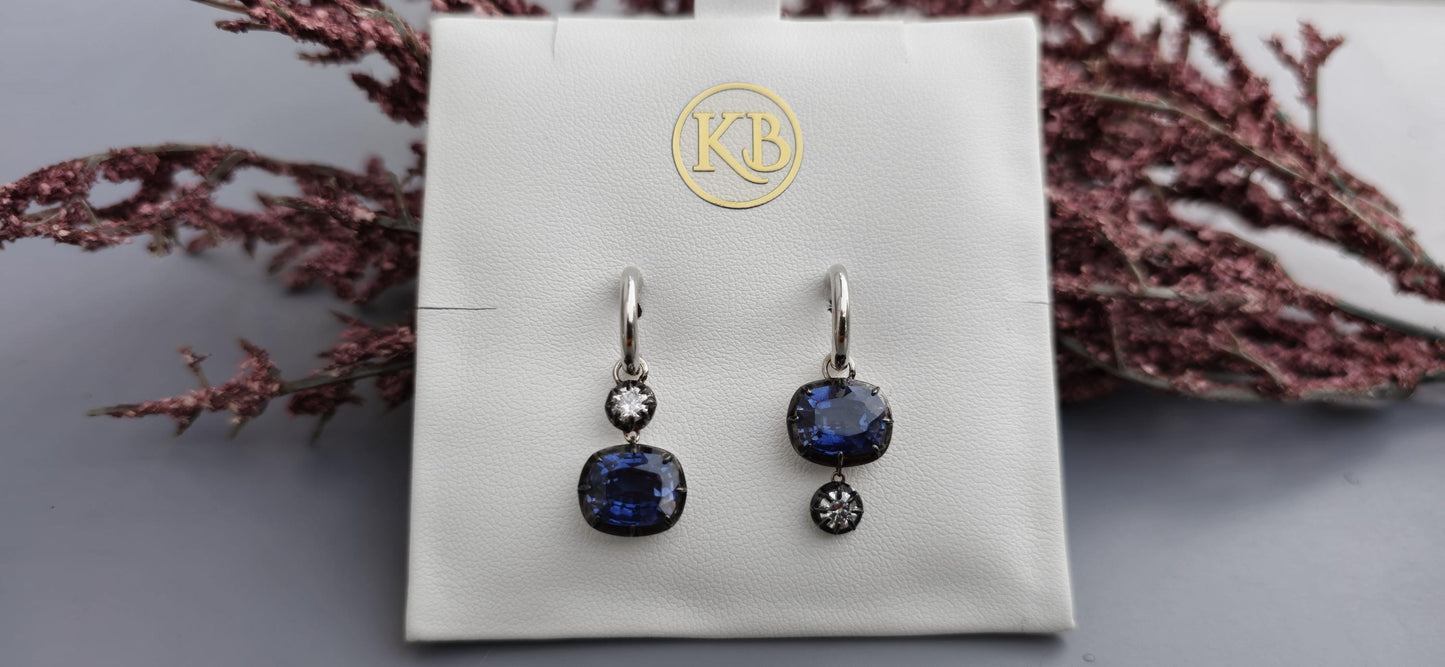 Women 4 stone asymmetric earrings, elongated cushion lab blue sapphire and cushion moissanite set in Georgian cut down button back setting.