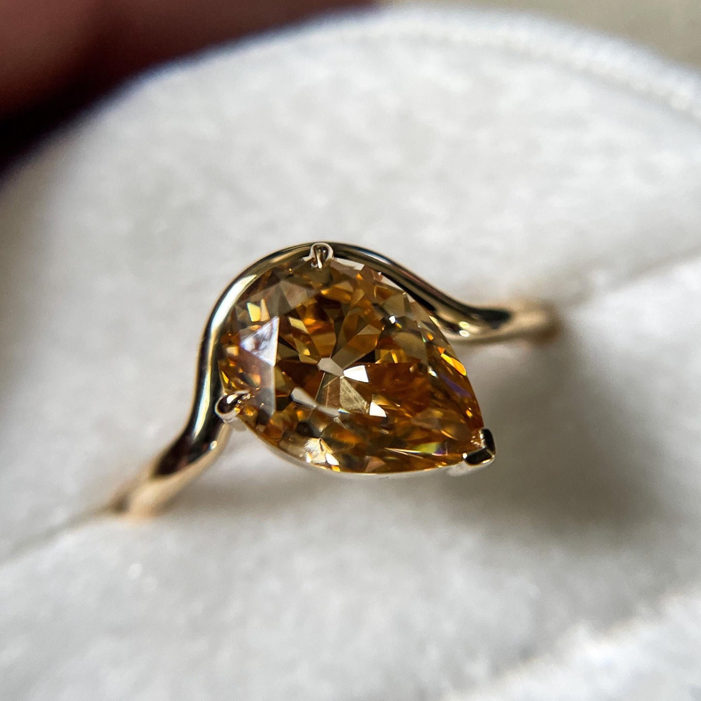 Tilted Floating Old Mine Antique Champagne Pear Cut Moissanite Engagement Ring.