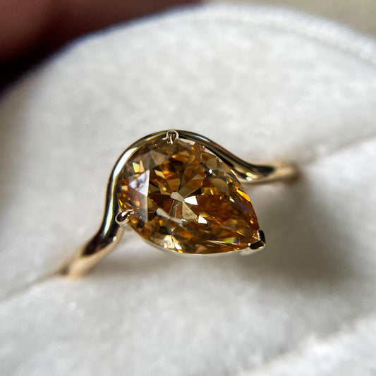 Tilted Floating Old Mine Antique Champagne Pear Cut Moissanite Engagement Ring.