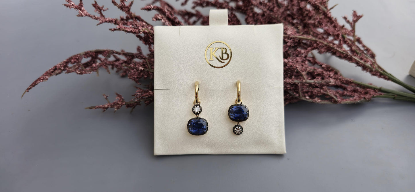 Women 4 stone asymmetric earrings, elongated cushion lab blue sapphire and cushion moissanite set in Georgian cut down button back setting.
