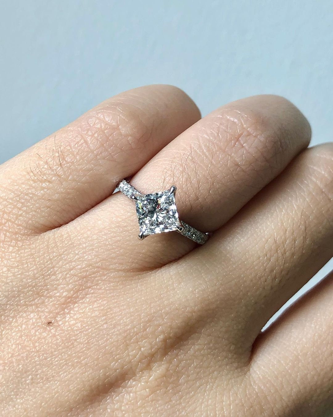 Vintage Compass pong Kite set Princess Cut moissanite with tulip basket and side pave solitaire Engagement ring, vintage-inspired setting.