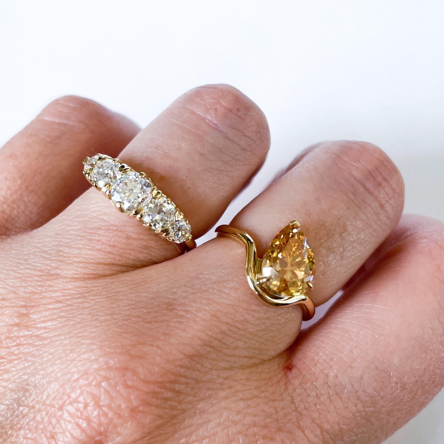 Tilted Floating Old Mine Antique Champagne Pear Cut Moissanite Engagement Ring.