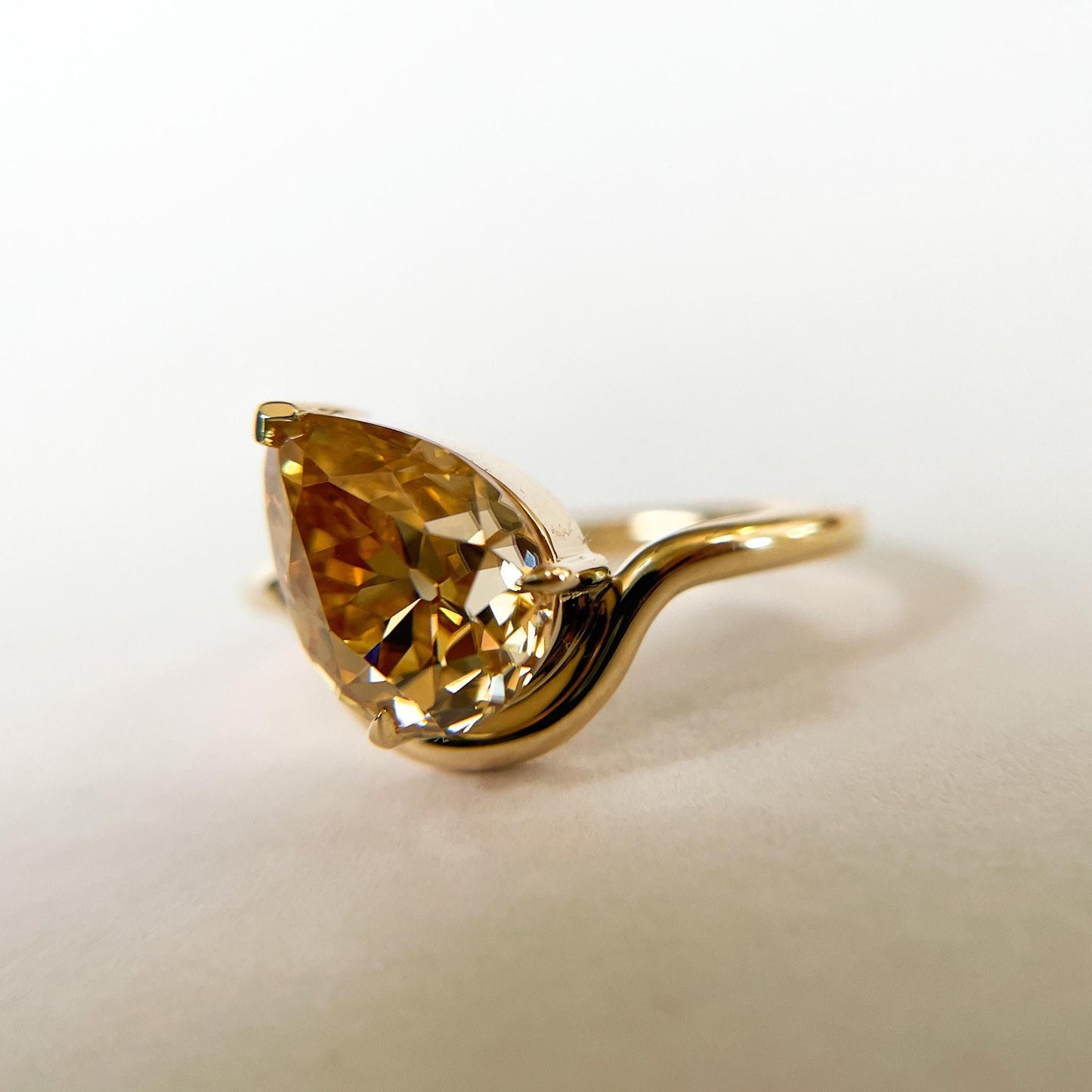 Tilted Floating Old Mine Antique Champagne Pear Cut Moissanite Engagement Ring.