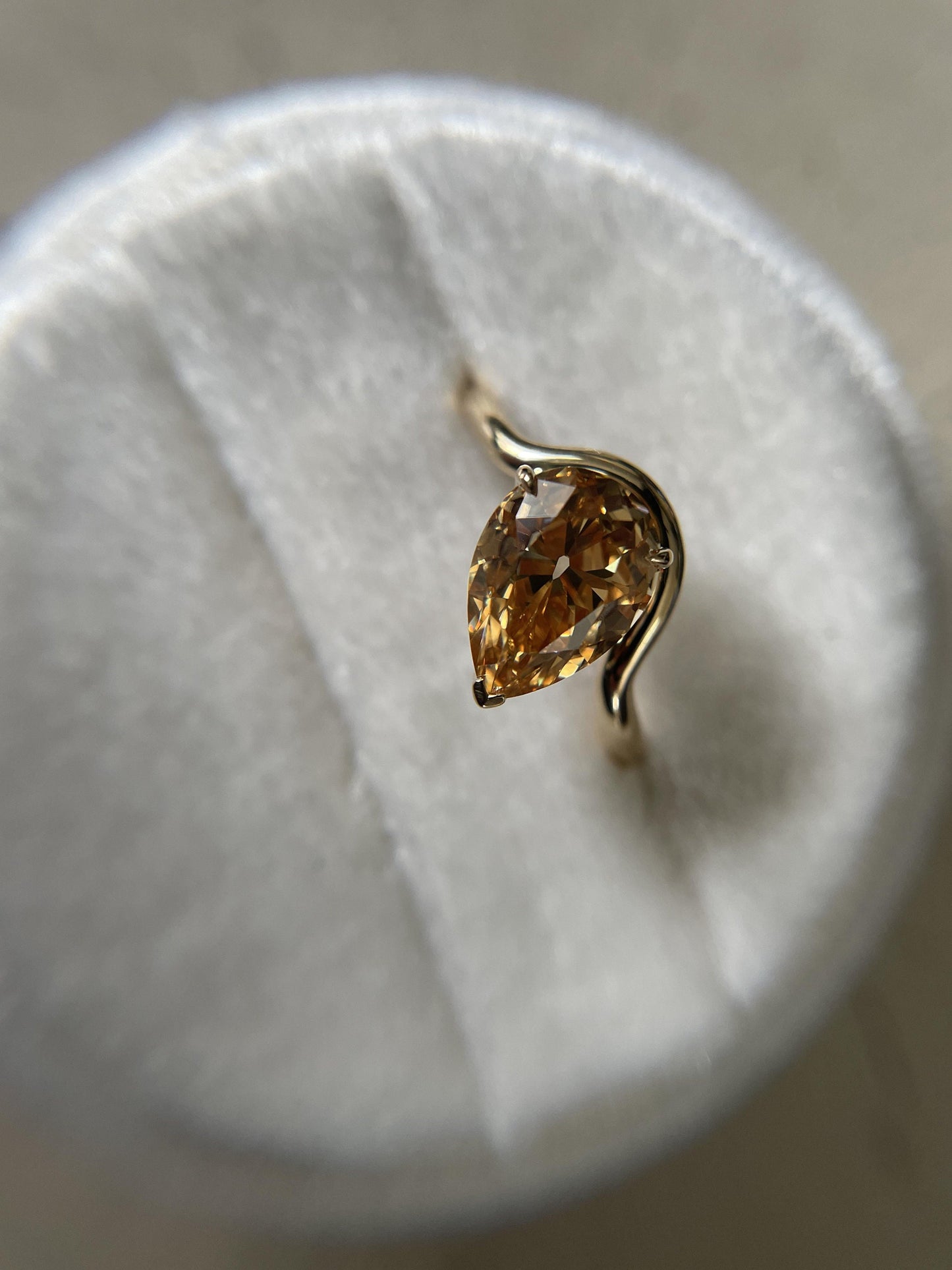 Tilted Floating Old Mine Antique Champagne Pear Cut Moissanite Engagement Ring.