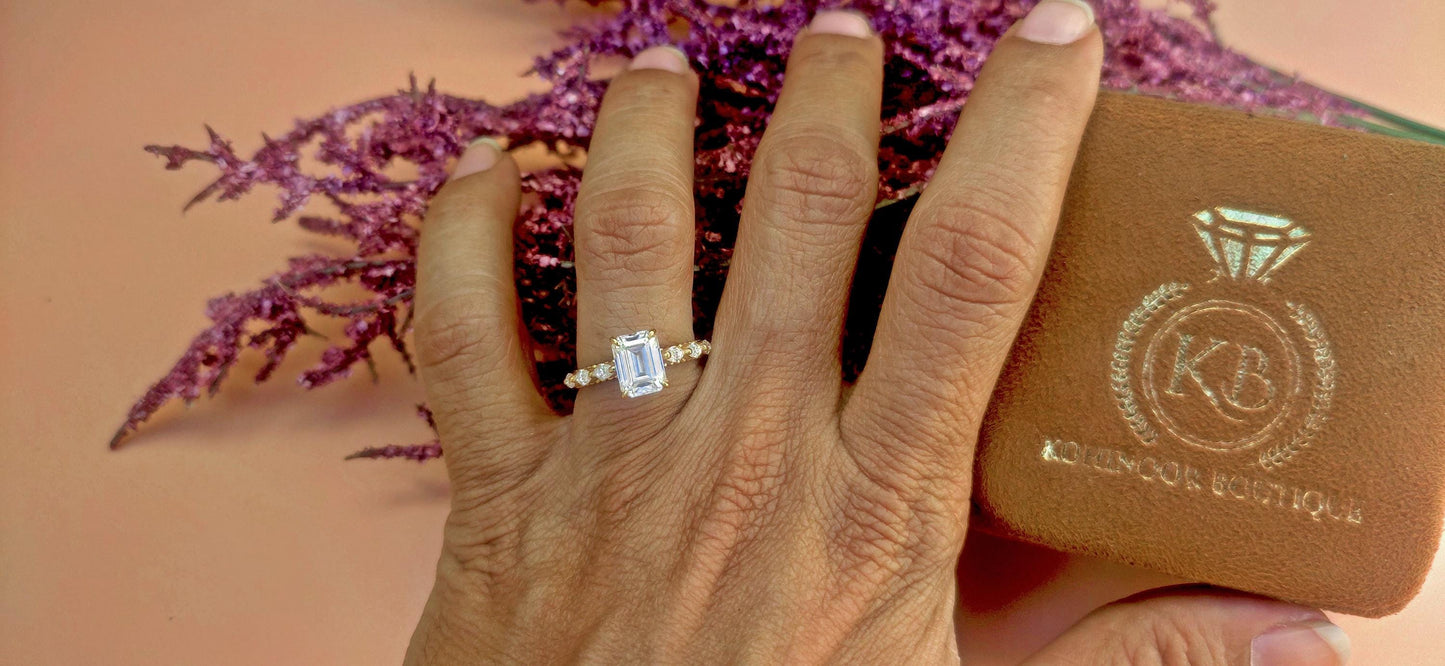 Emerald Cut Moissanite Solitaire Engagement Ring with Side east-west set Marquise, Unique Cathedral setting and millegrain detail.