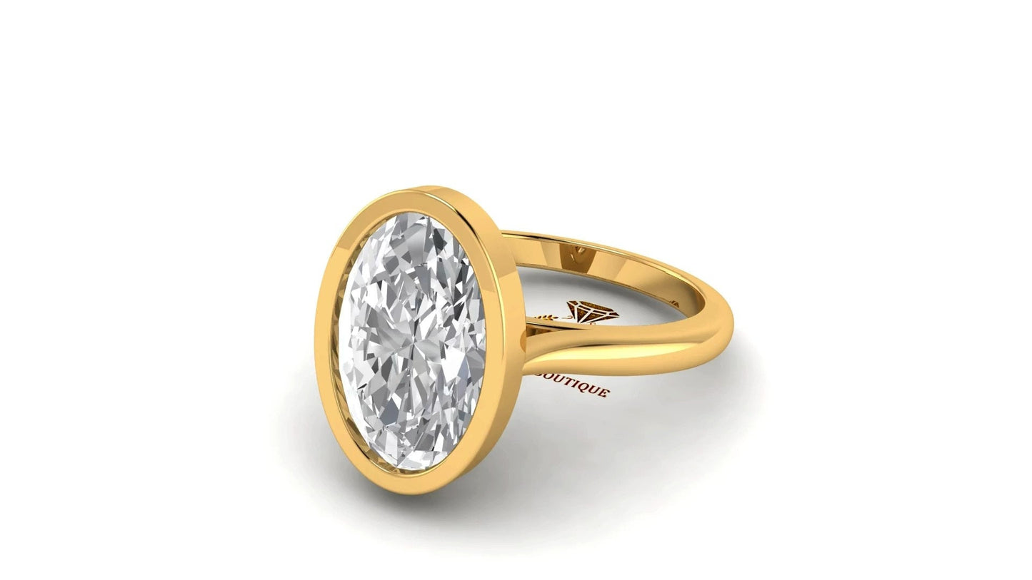 Oval Cut Moissanite Bezel set with twisted basket Solitaire Engagement Ring, Customisable in any size and shape of moissanite.