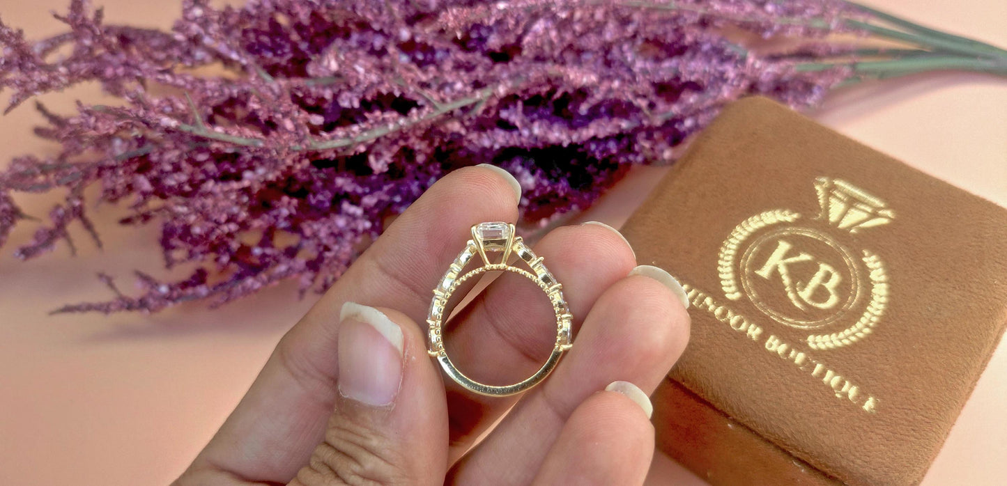 Emerald Cut Moissanite Solitaire Engagement Ring with Side east-west set Marquise, Unique Cathedral setting and millegrain detail.