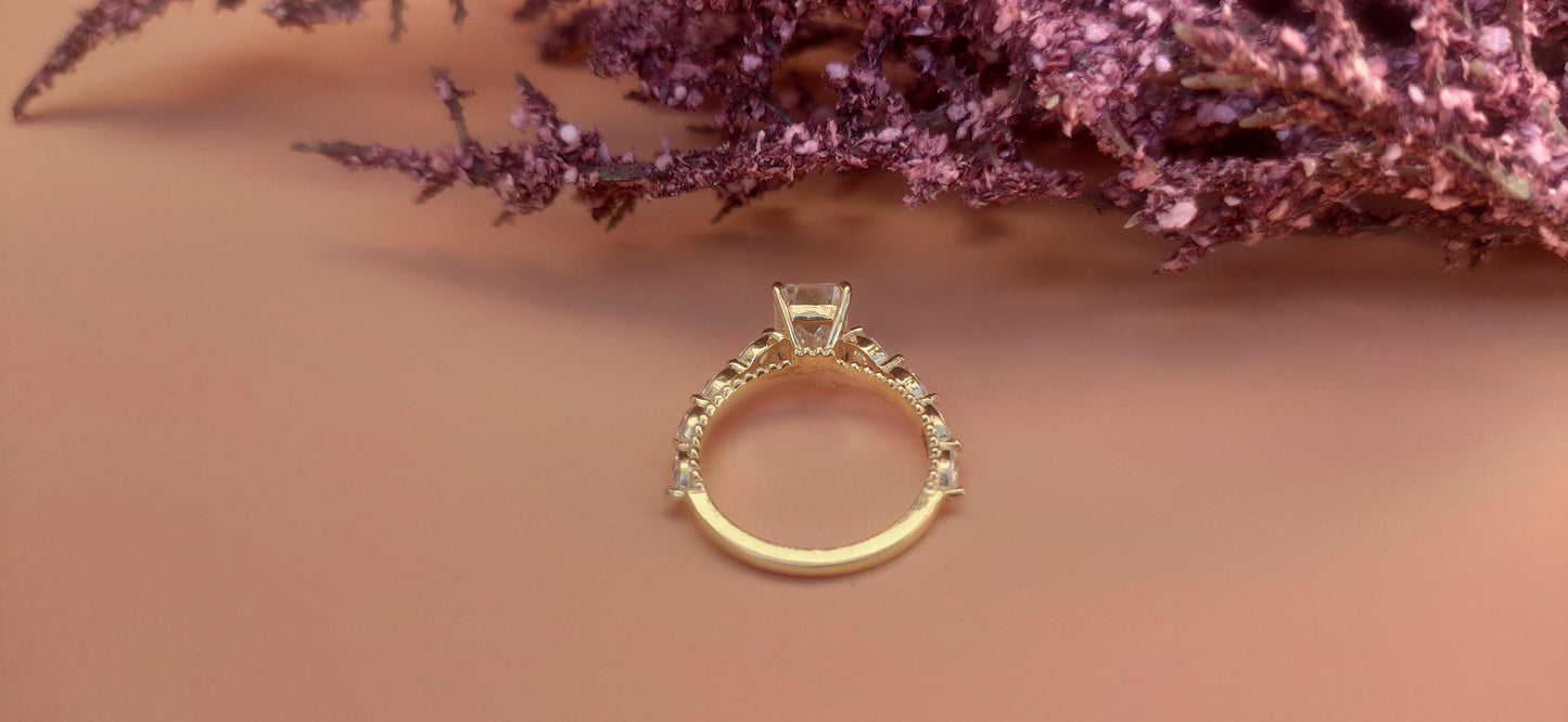 Emerald Cut Moissanite Solitaire Engagement Ring with Side east-west set Marquise, Unique Cathedral setting and millegrain detail.