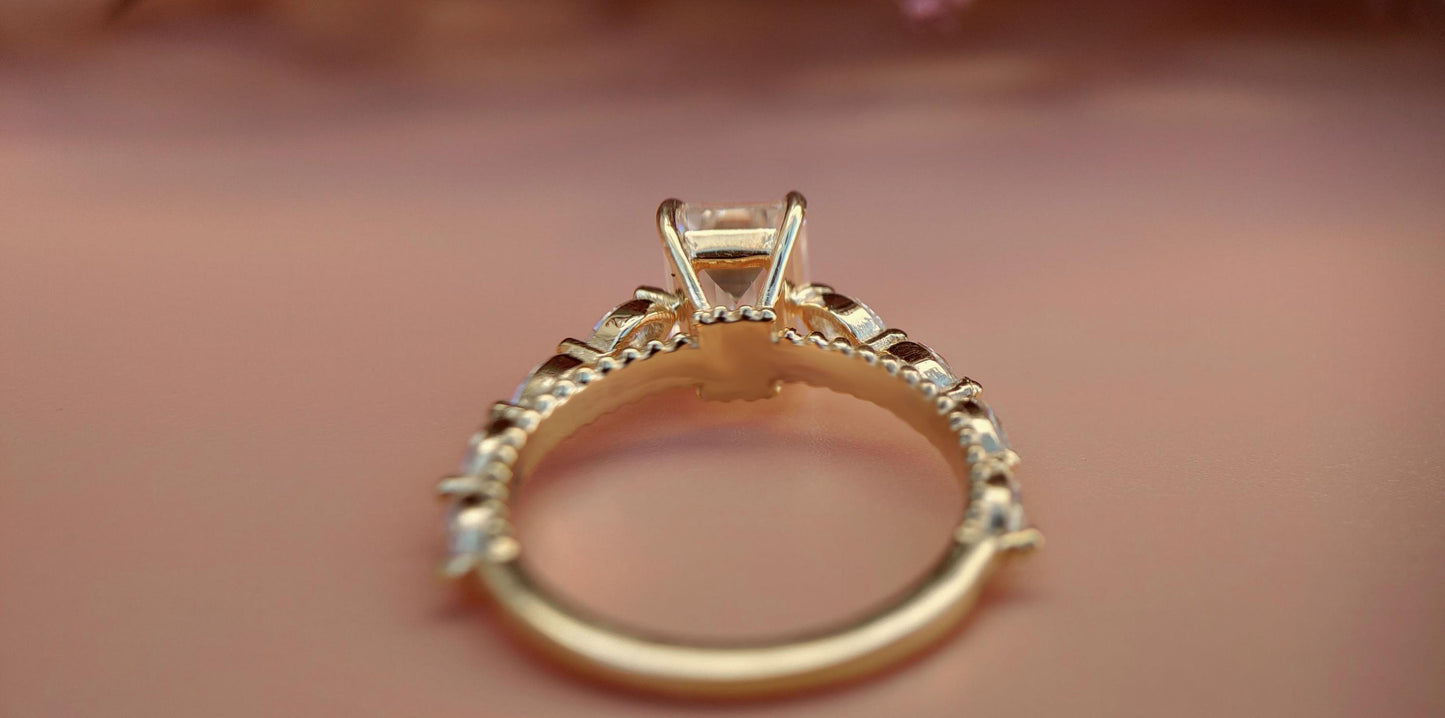 Emerald Cut Moissanite Solitaire Engagement Ring with Side east-west set Marquise, Unique Cathedral setting and millegrain detail.