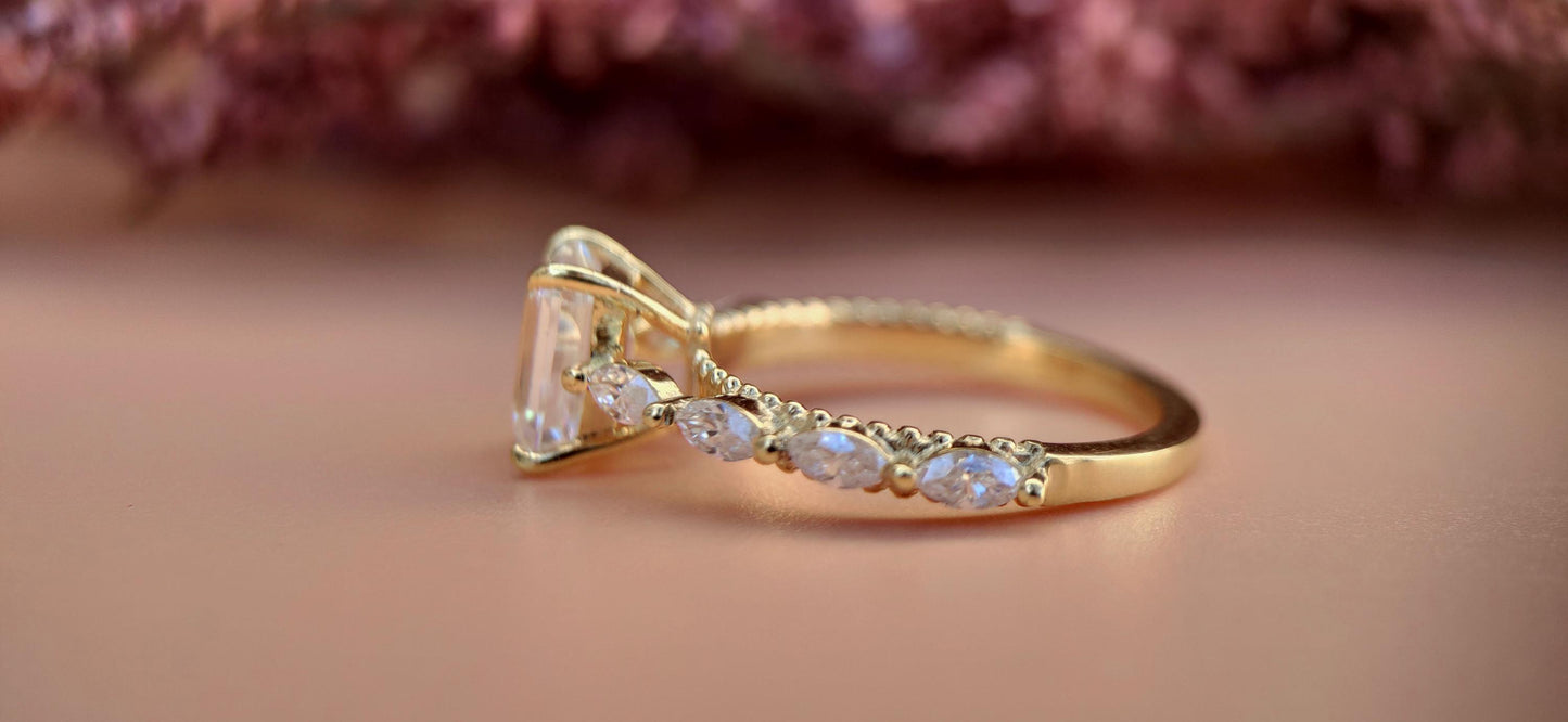 Emerald Cut Moissanite Solitaire Engagement Ring with Side east-west set Marquise, Unique Cathedral setting and millegrain detail.