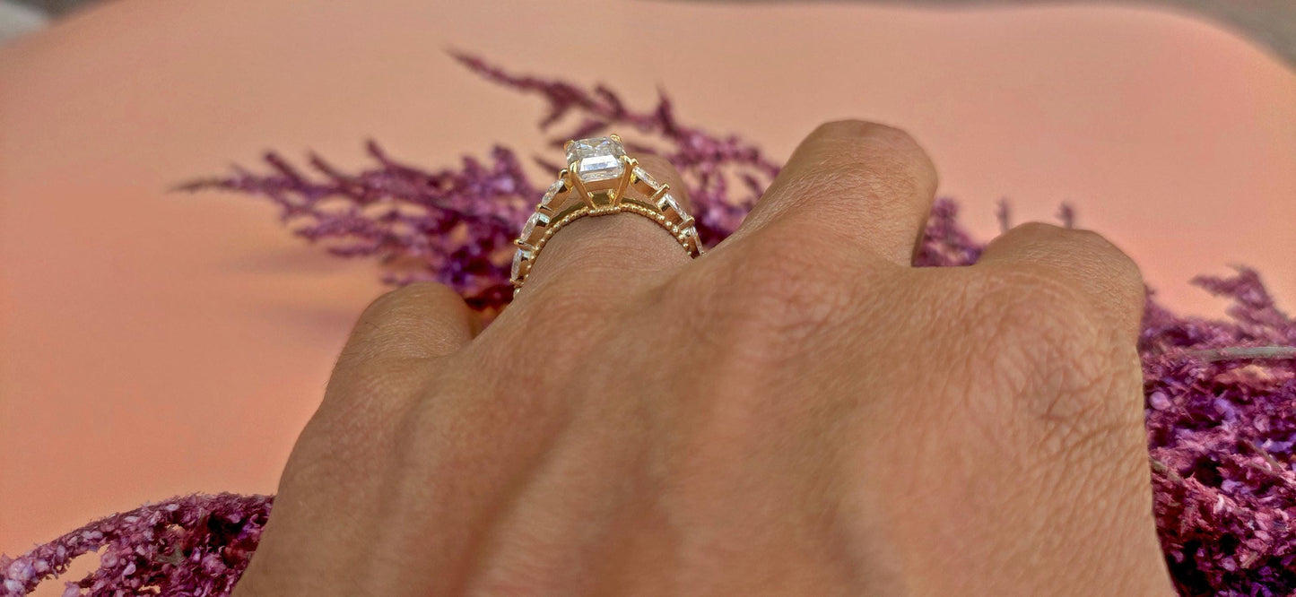 Emerald Cut Moissanite Solitaire Engagement Ring with Side east-west set Marquise, Unique Cathedral setting and millegrain detail.